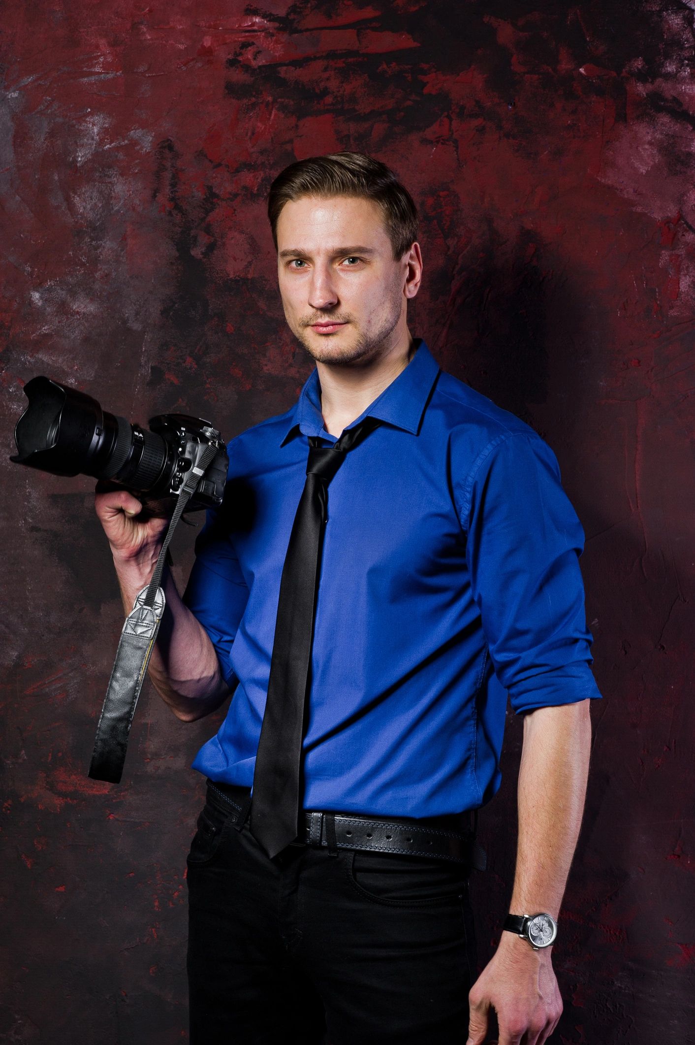 Professional photographer portrait with camera
